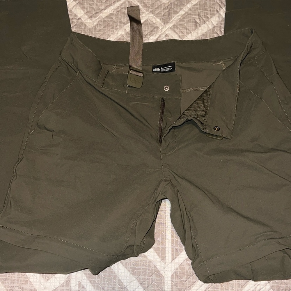 Two pairs of north face hiking pants with zipper short